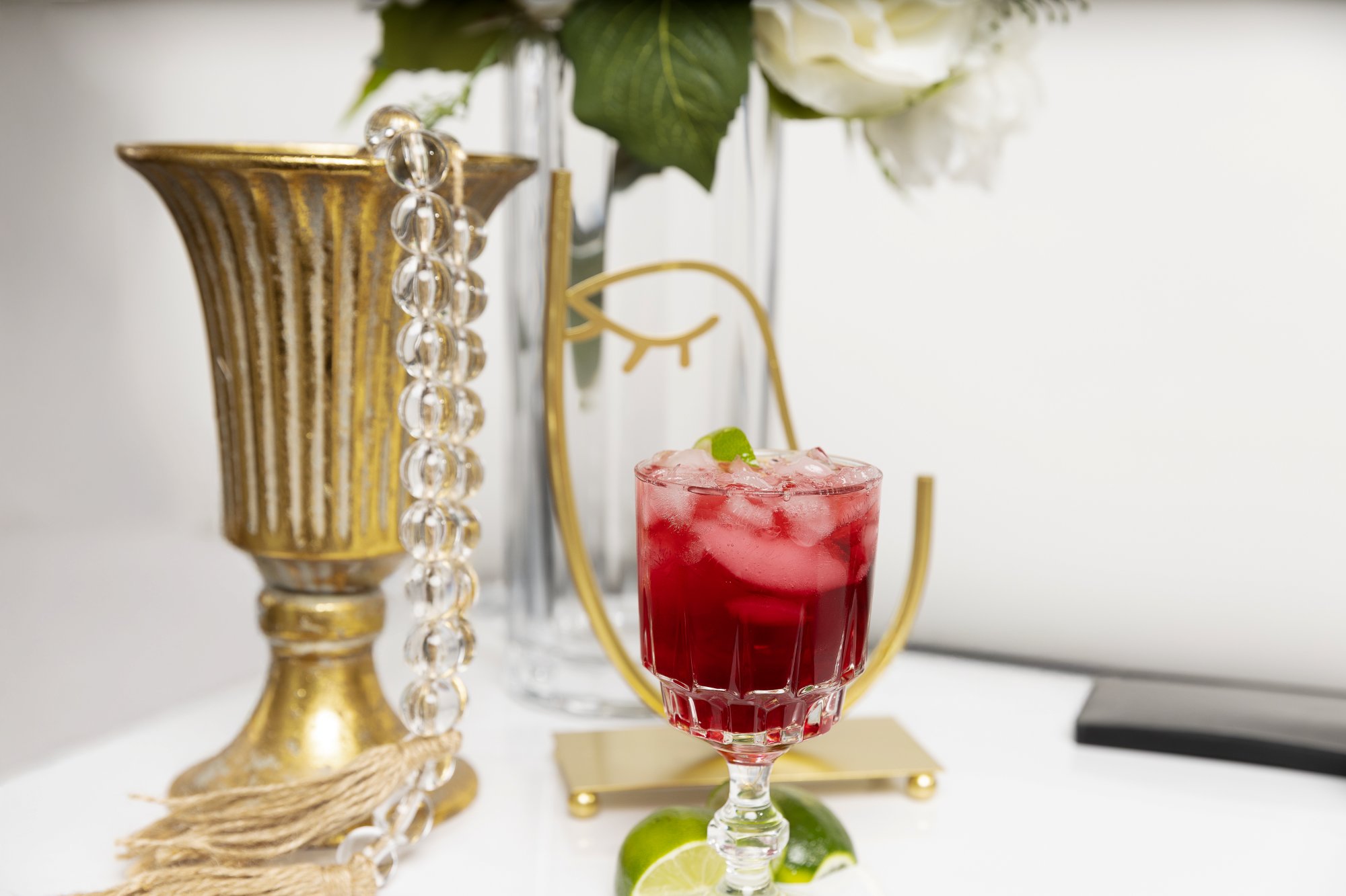 Handcrafted red mocktail with gold accents