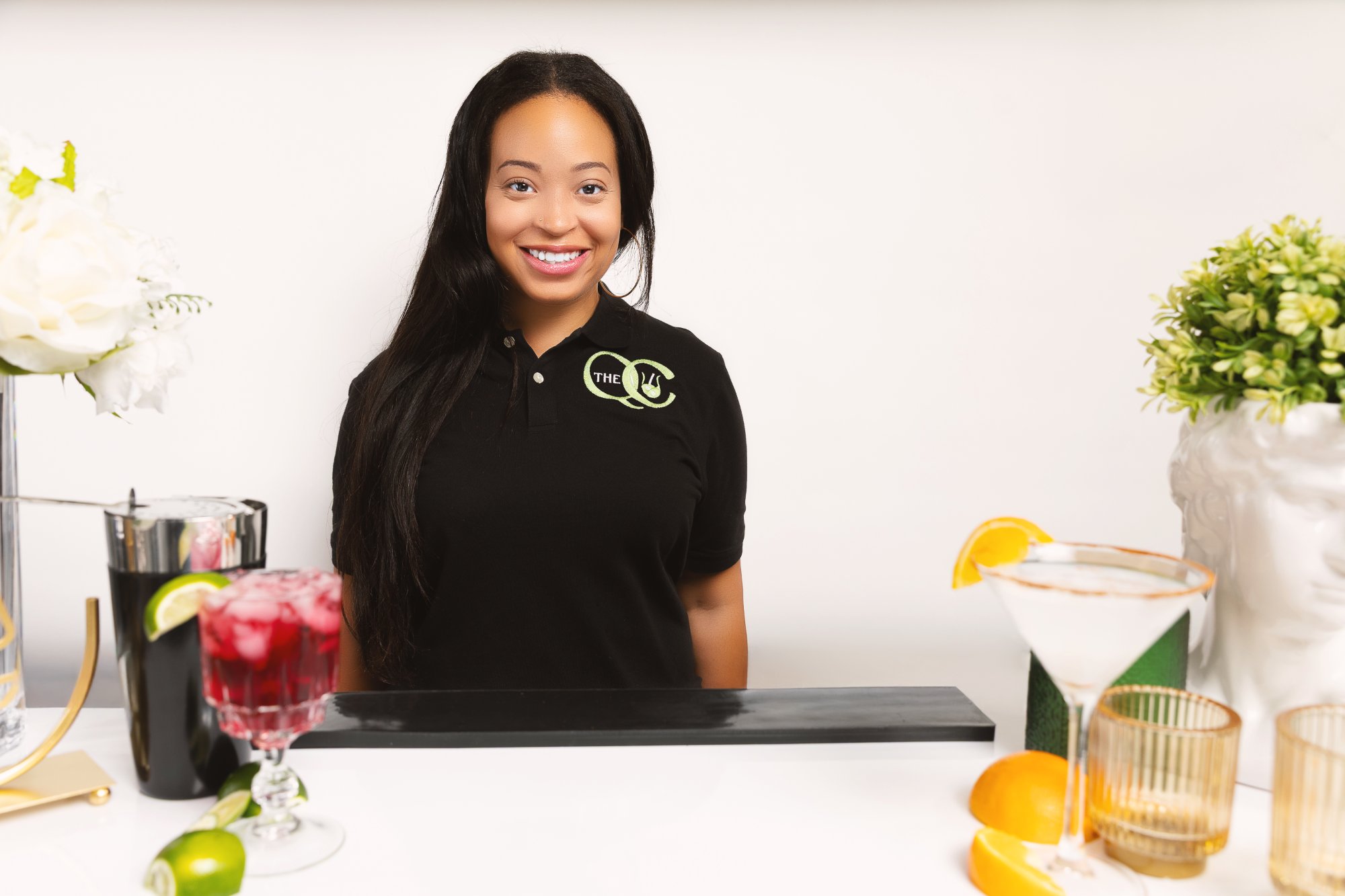 Breyuna smiling behind bar